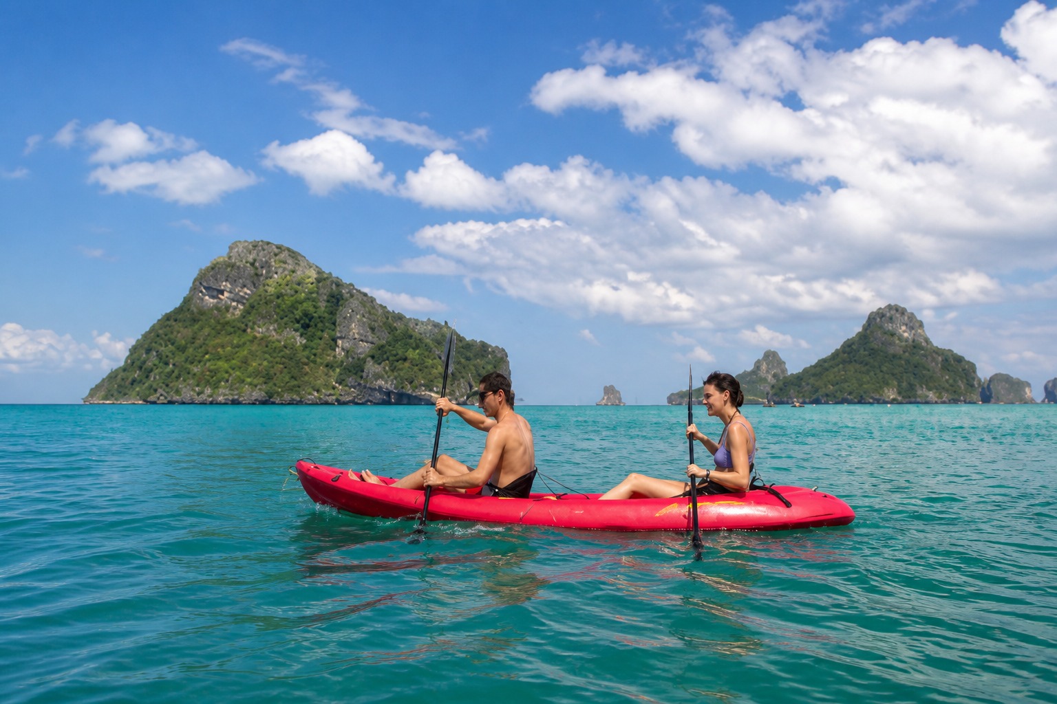Couple in a tandem kayak between the Ang Thong islands