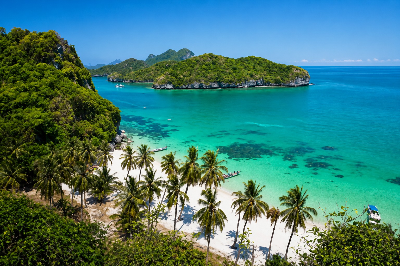 Palm-fringed white sand beach and turquoise bay at Ang Thong Marine Park