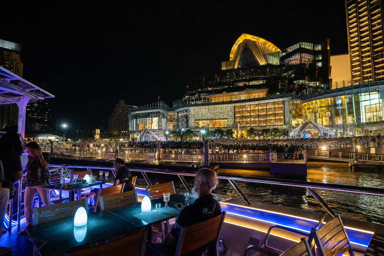 ICONSIAM lit up at night on the Chao Phraya