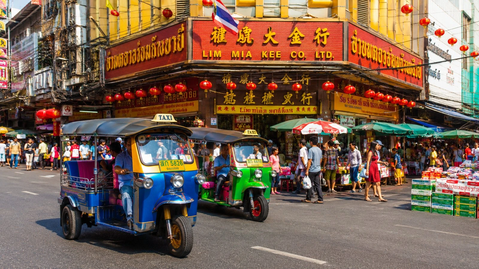 Tuk-tuk driving through Bangkok Chinatown